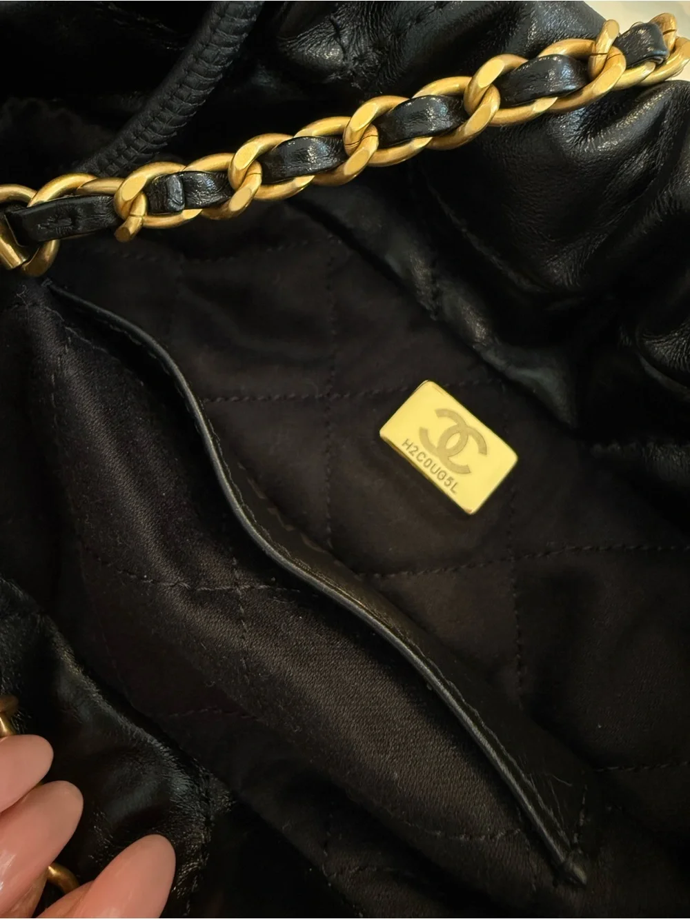 CHANEL 22 Mini Black Quilted Leather Drawstring Crossbody with Gold Logo Charm